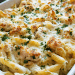 Creamy Chicken Alfredo Bake in a casserole dish