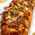 Vegan BBQ pull apart bread with cheesy layers in a loaf pan