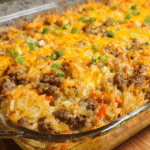Cheesy ground beef and hashbrown casserole baked until golden