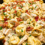 Creamy chicken bacon ranch tortellini in a skillet