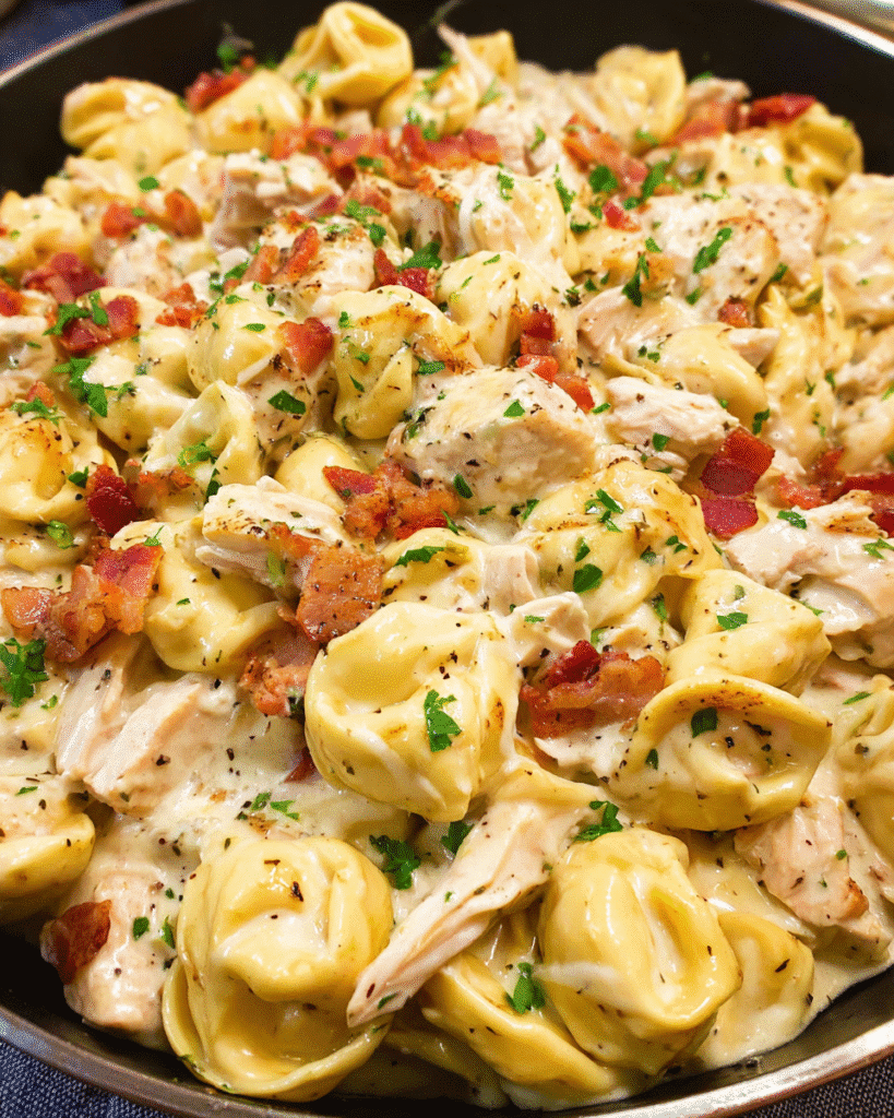 Creamy chicken bacon ranch tortellini in a skillet
