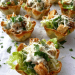 Chicken Caesar Salad Cups served in baked wonton shells
