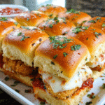 Chicken Parmesan Sliders baked with mozzarella and garlic butter