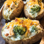 Chicken and broccoli stuffed potatoes with creamy cheese sauce