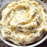 Creamy garlic mashed potatoes in a serving bowl
