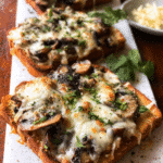 Garlic Mushroom Cheese Toasts topped with golden mushrooms and melted cheese