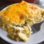 Green chili chicken enchilada casserole sliced and served