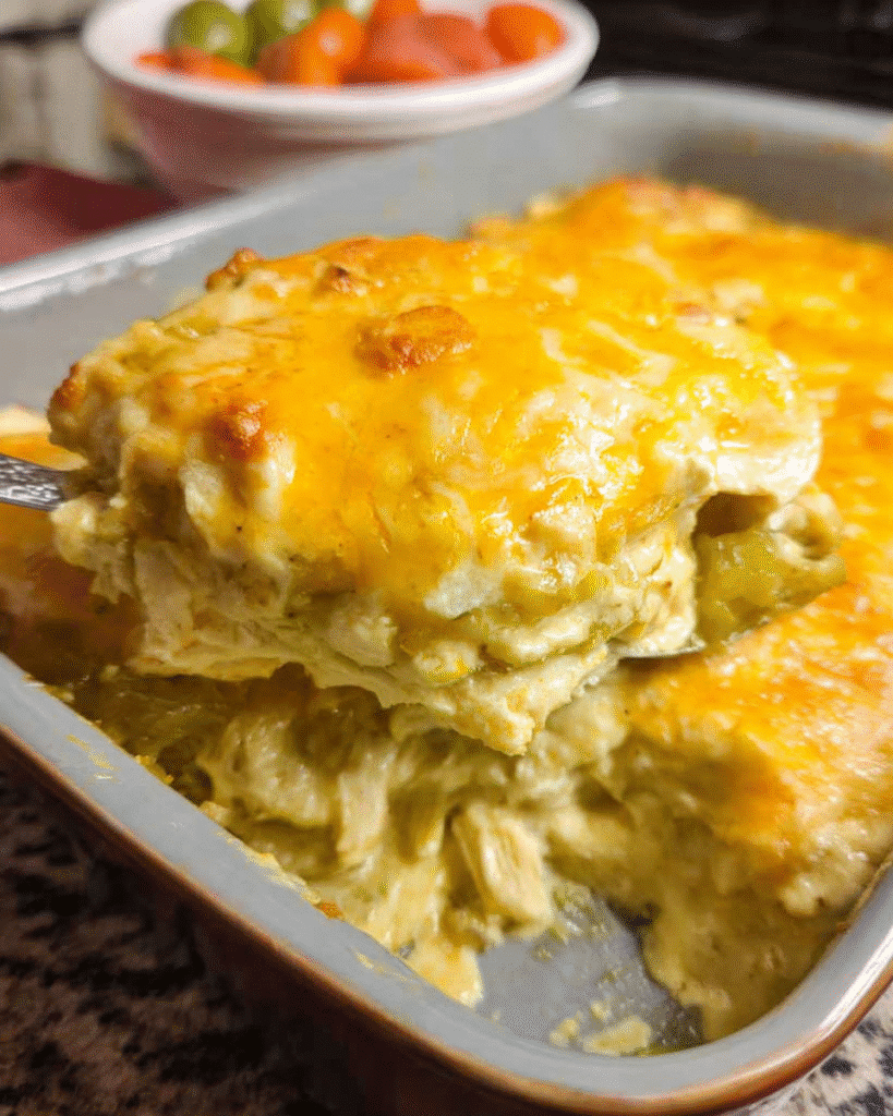 Green chili chicken enchilada casserole sliced and served