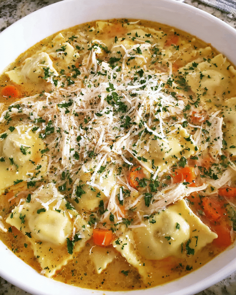 Italian chicken ravioli soup served hot in a bowl