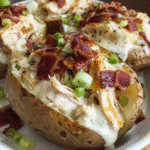 Loaded Chicken and Bacon Alfredo Potato with creamy Alfredo sauce