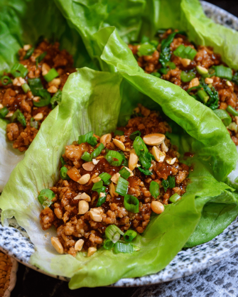 Sweet and Spicy Chicken Lettuce Wraps with fresh toppings