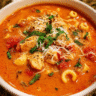 Bowl of tomato basil chicken soup with parmesan
