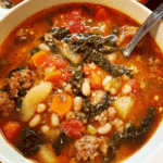Bowl of Tuscan white bean and turkey sausage soup with kale