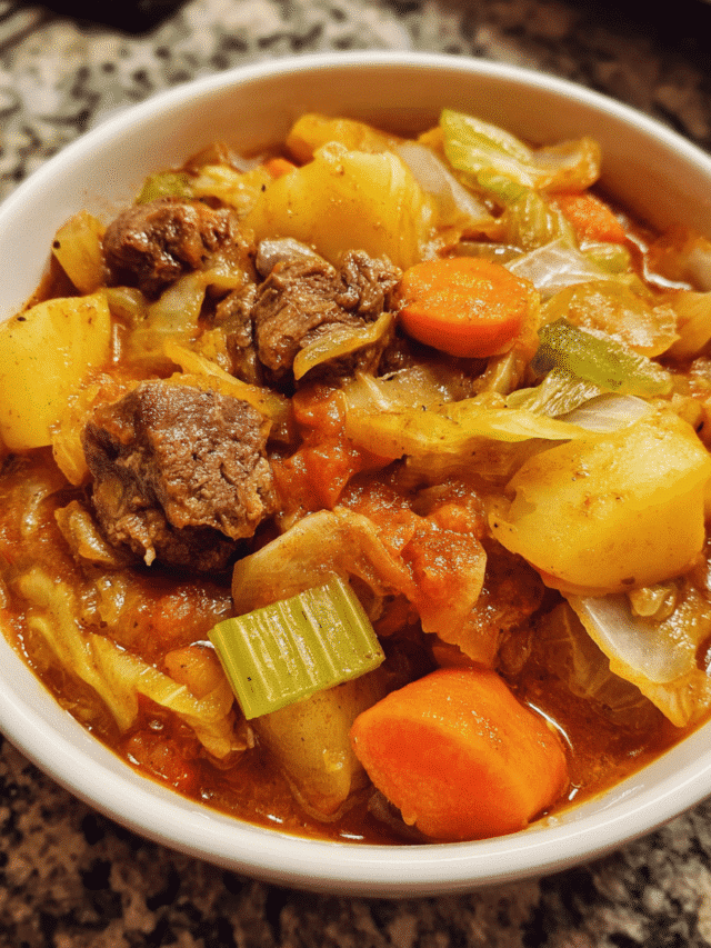 Bowl of beef and cabbage stew with vegetables
