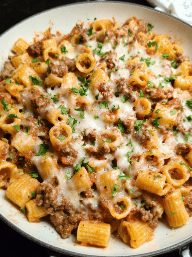 Cheesy beef pasta skillet with melted cheese and herbs