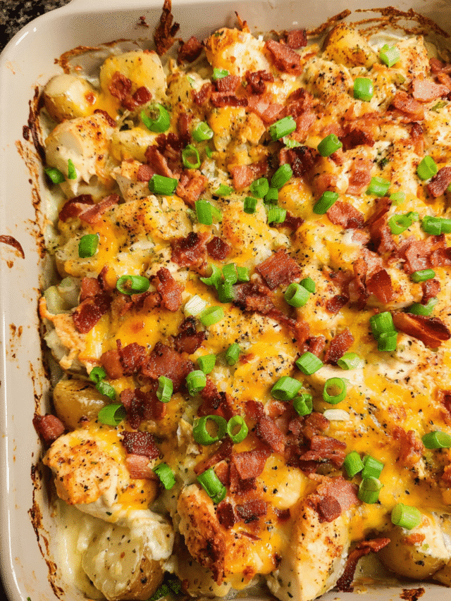 Chicken Bacon Ranch Potato Bake in casserole dish with melted cheese and bacon