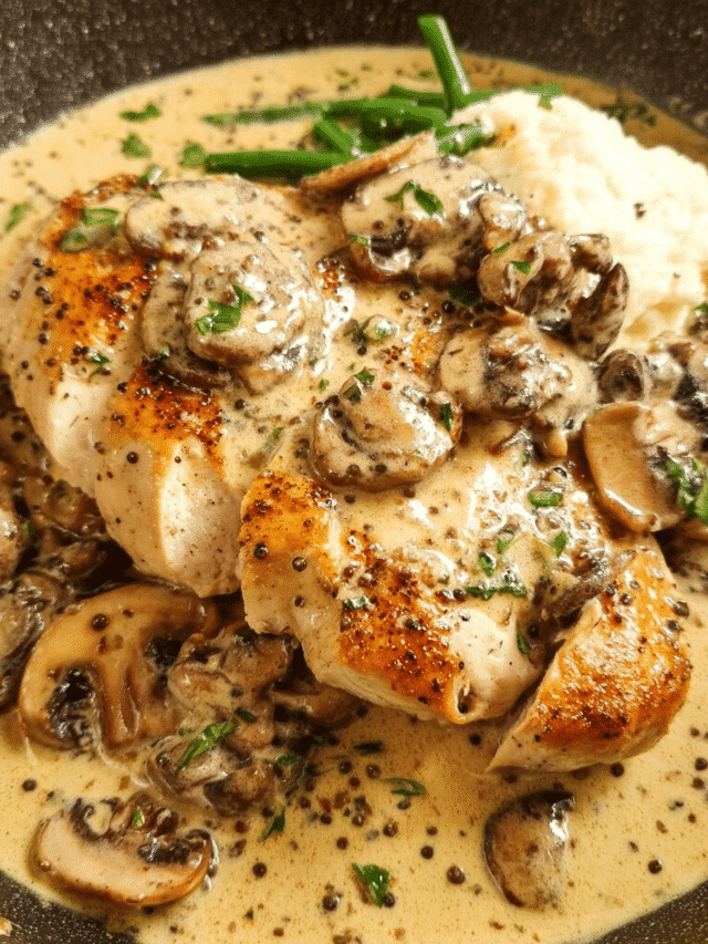 Creamy Peppercorn Chicken in a skillet with mushrooms and peppercorn sauce