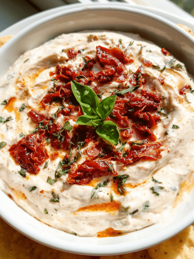 Creamy Sun-Dried Tomato Dip served with fresh vegetables and bread