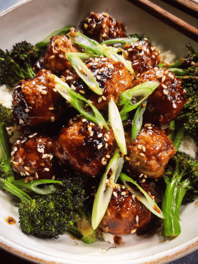 Honey garlic meatballs in a skillet with broccoli and glossy sauce