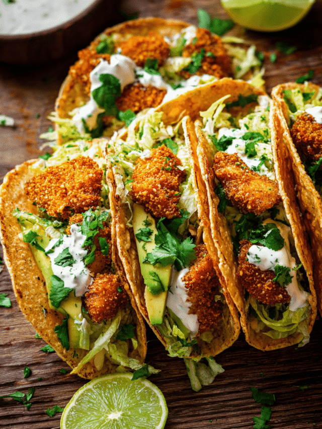 Crispy Cajun chicken tacos with crunchy coating, fresh toppings, and lime yogurt sauce.
