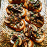 Roasted mushroom crostini topped with caramelized mushrooms and goat cheese