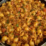 Beef taco pasta skillet with melted cheese