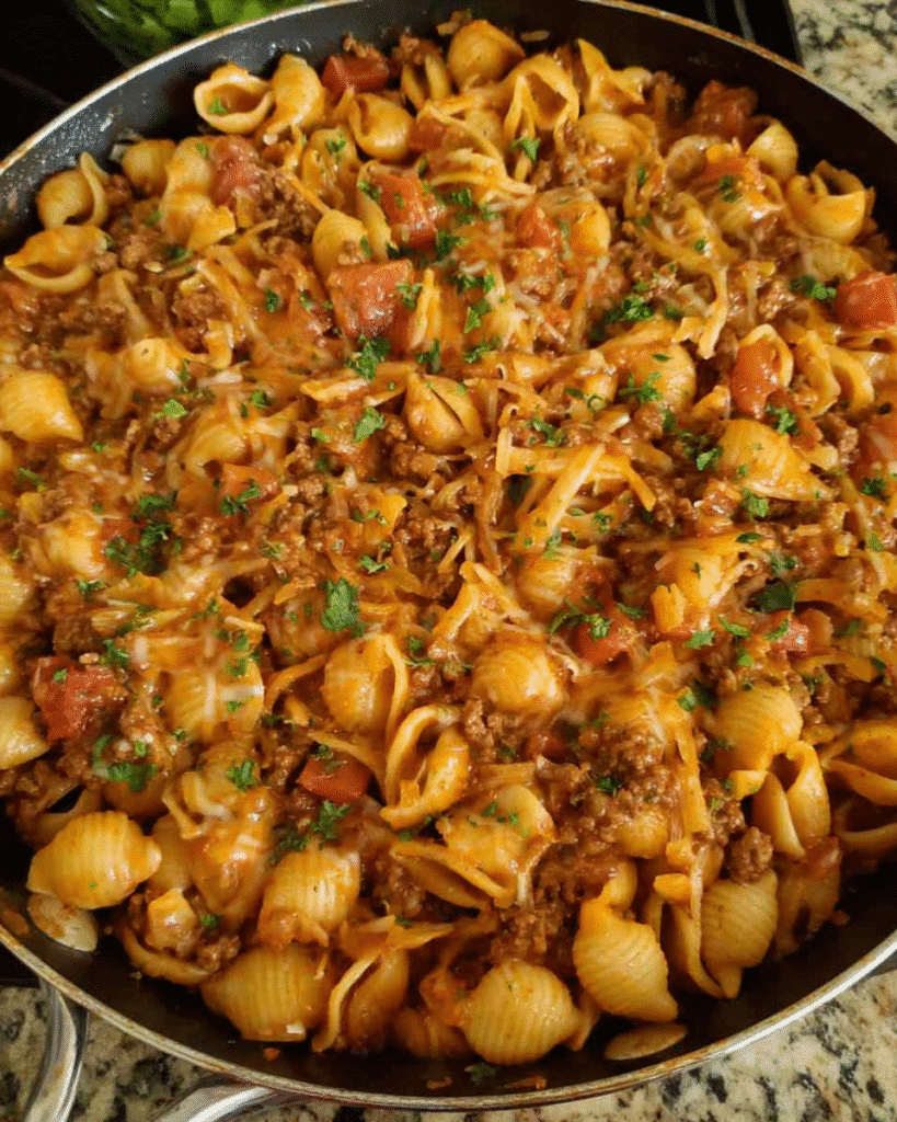 Beef taco pasta skillet with melted cheese
