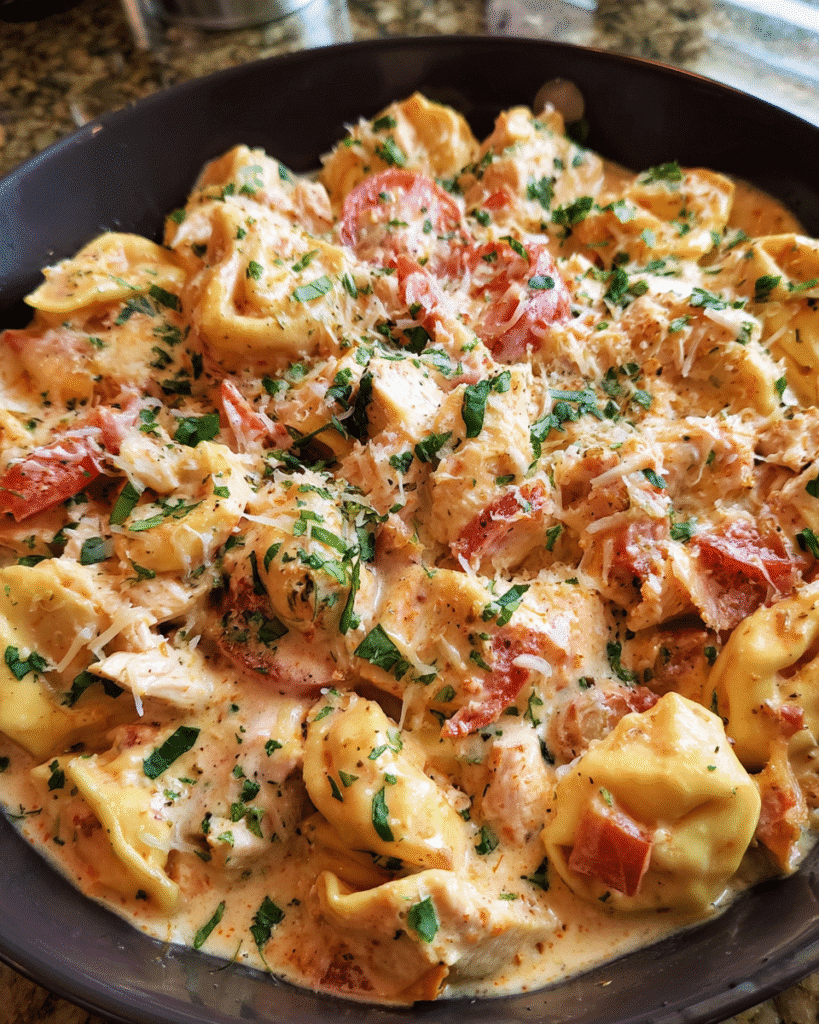 Creamy Tomato Chicken Tortellini and Bacon in skillet