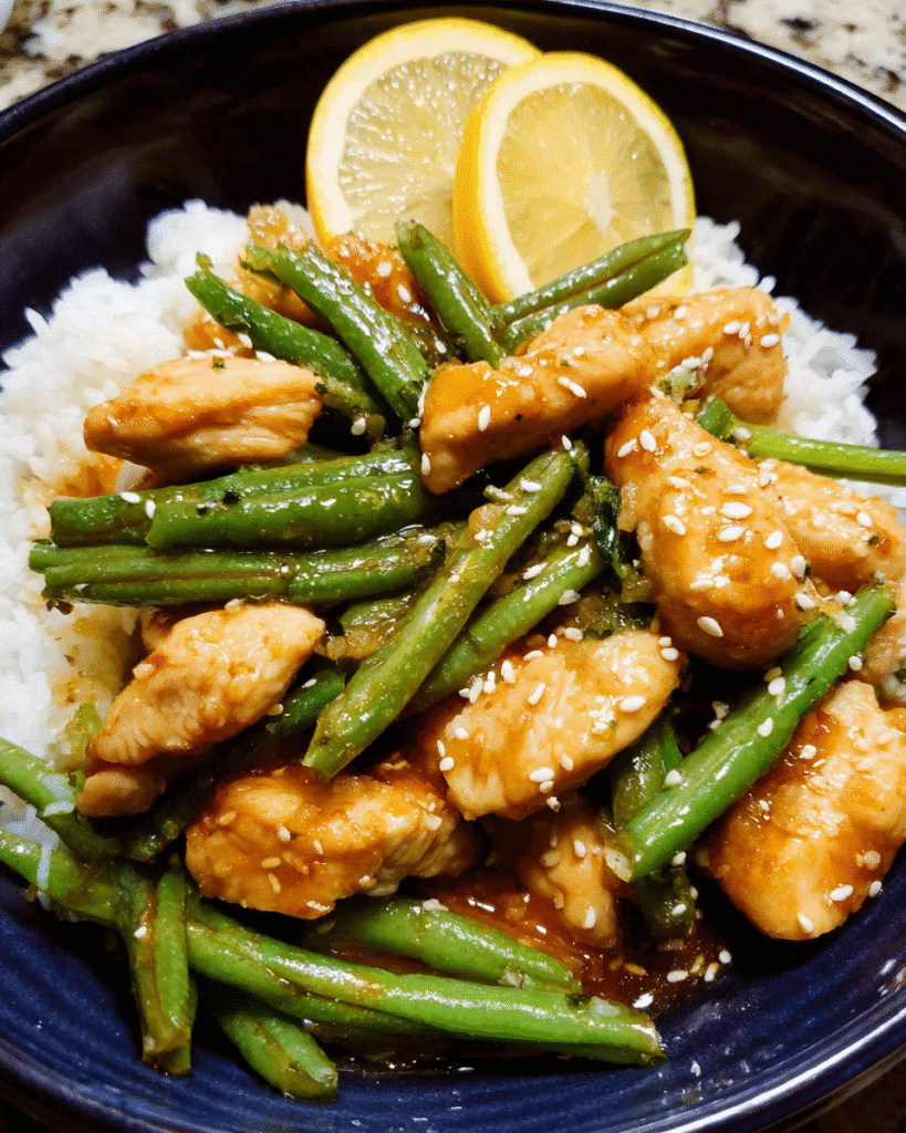 Lemon chicken stir fry with green beans in skillet