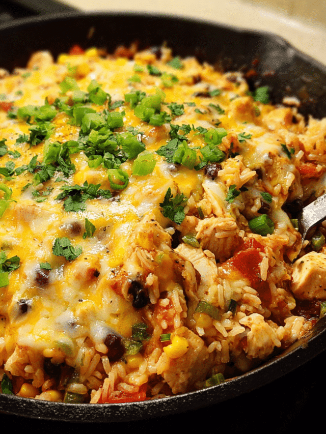 Cheesy chicken burrito skillet with rice and melted cheese
