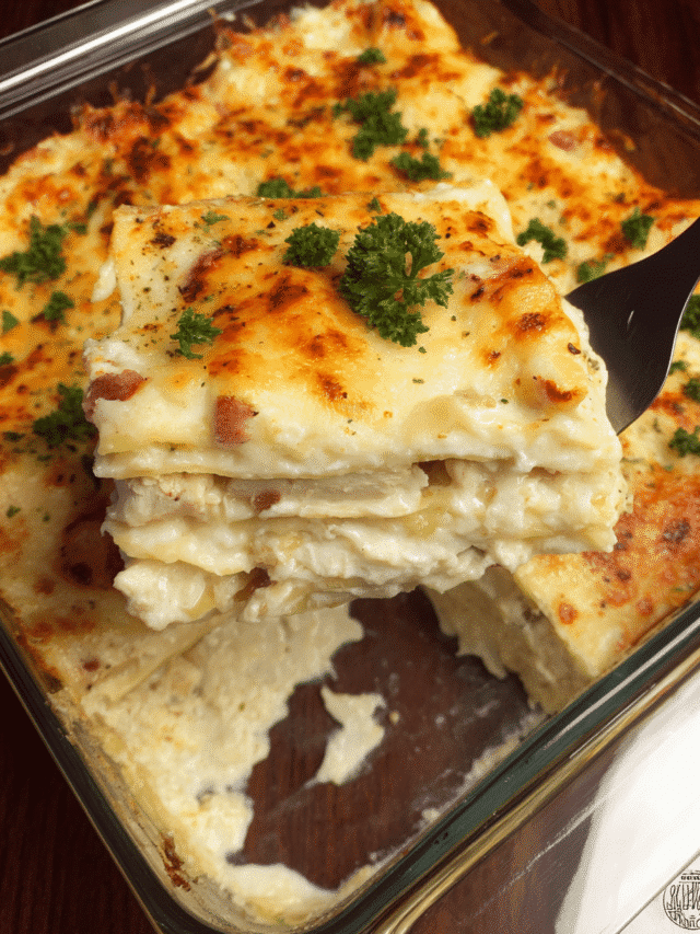 Chicken Bacon Alfredo Lasagna baked in a casserole dish with golden melted cheese on top