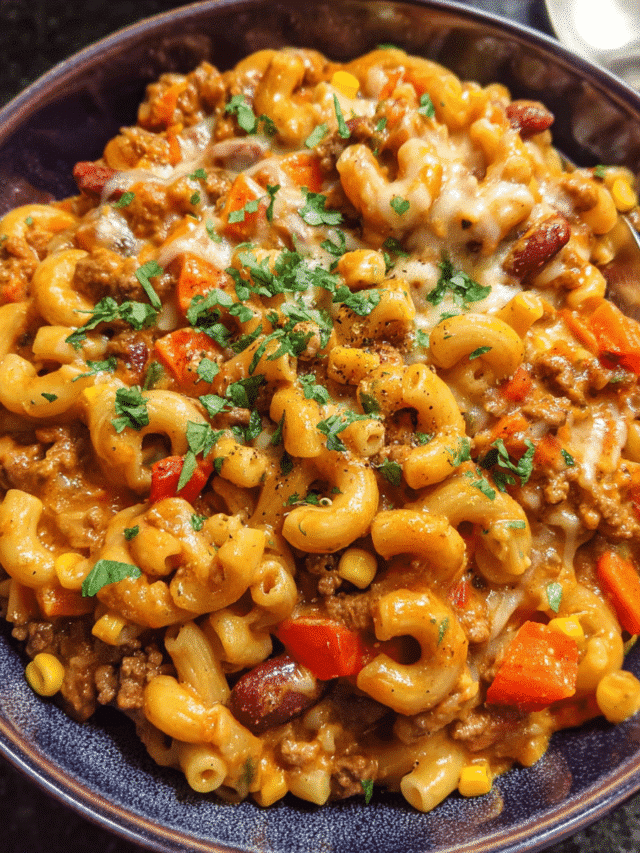 Vegan chili mac and cheese in a bowl topped with cilantro