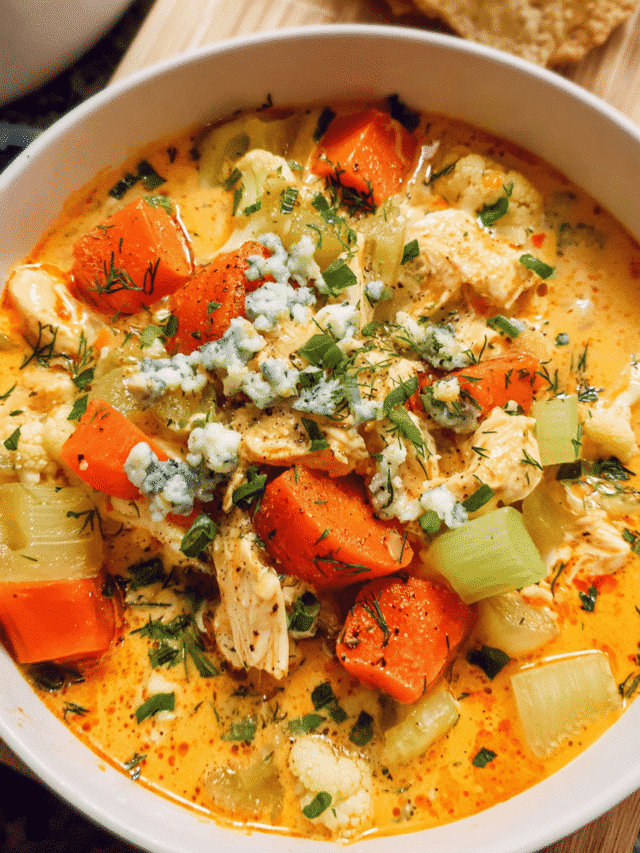 Bowl of creamy buffalo chicken soup with toppings