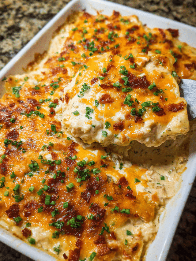 Creamy Chicken Ranch Lasagna layered with cheese and herbs in a casserole dish