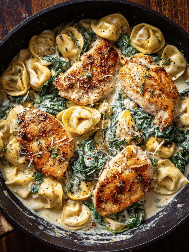Creamy Chicken and Spinach Tortellini in a skillet with parmesan