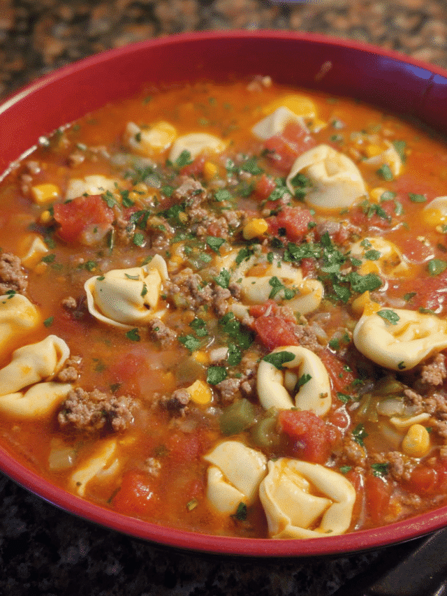 Bowl of Taco Tortellini Soup with corn and cilantro