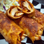 Crispy BBQ chicken wrap with coleslaw and melted cheese