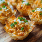 Buffalo Chicken Phyllo Cups baked until golden and filled with creamy spicy chicken