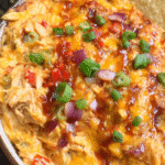 Cheesy BBQ Chicken Dip baked with melted cheddar and barbecue sauce