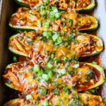Cheesy Chicken Enchilada Boats baked with melted cheddar and fresh cilantro