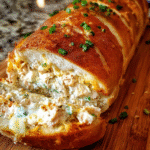Cheesy Chicken Ranch Stuffed Bread sliced and served warm