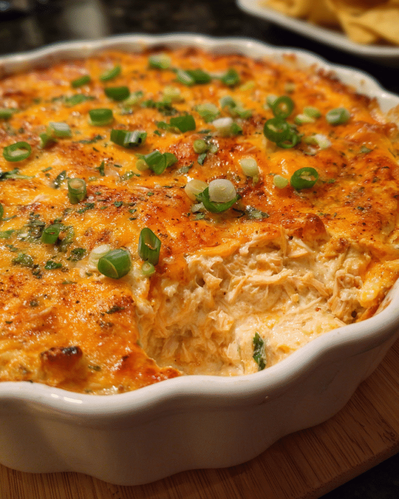 Cheesy Chicken Taco Dip baked until golden and bubbly
