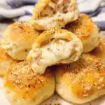 Golden Chicken Alfredo Cheese Bombs brushed with garlic butter and Parmesan