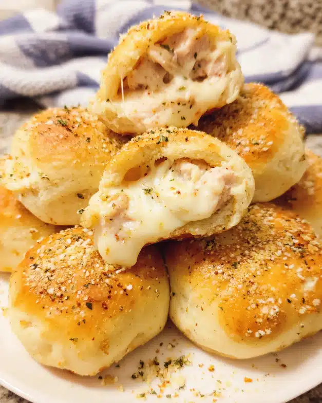 Golden Chicken Alfredo Cheese Bombs brushed with garlic butter and Parmesan