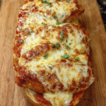 Chicken Parm Bread Boat sliced with crispy chicken and melted provolone