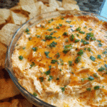 Baked chicken taco queso dip served hot with tortilla chips
