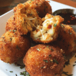 Golden crispy chicken cheese balls with melted mozzarella center