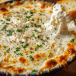 Hot Chicken Alfredo Dip baked until golden and bubbly