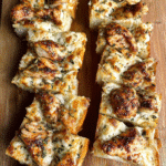 Viral Chicken Alfredo Garlic Bread sliced and served warm