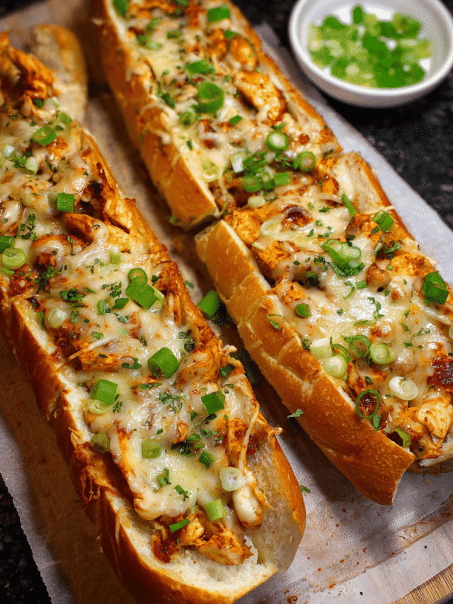 Buffalo chicken garlic bread sliced and topped with jalapeños and green onions